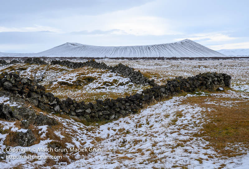 3081-0029-Rock-Wall-With-Hverfjall-Crater-In-The-Distance